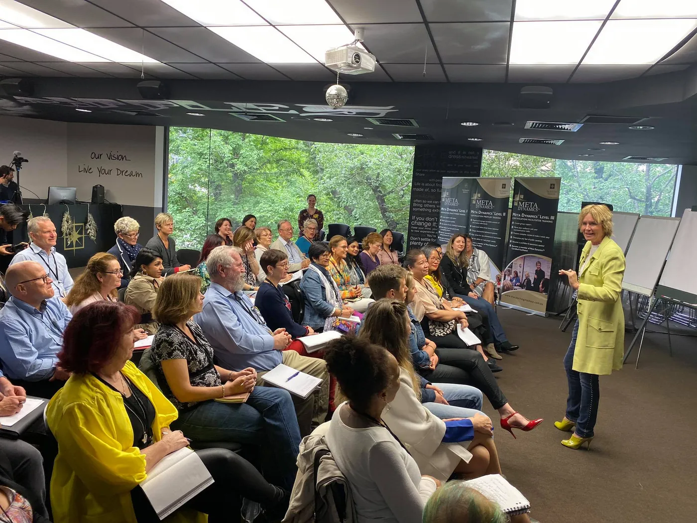 Remi teaching a full room